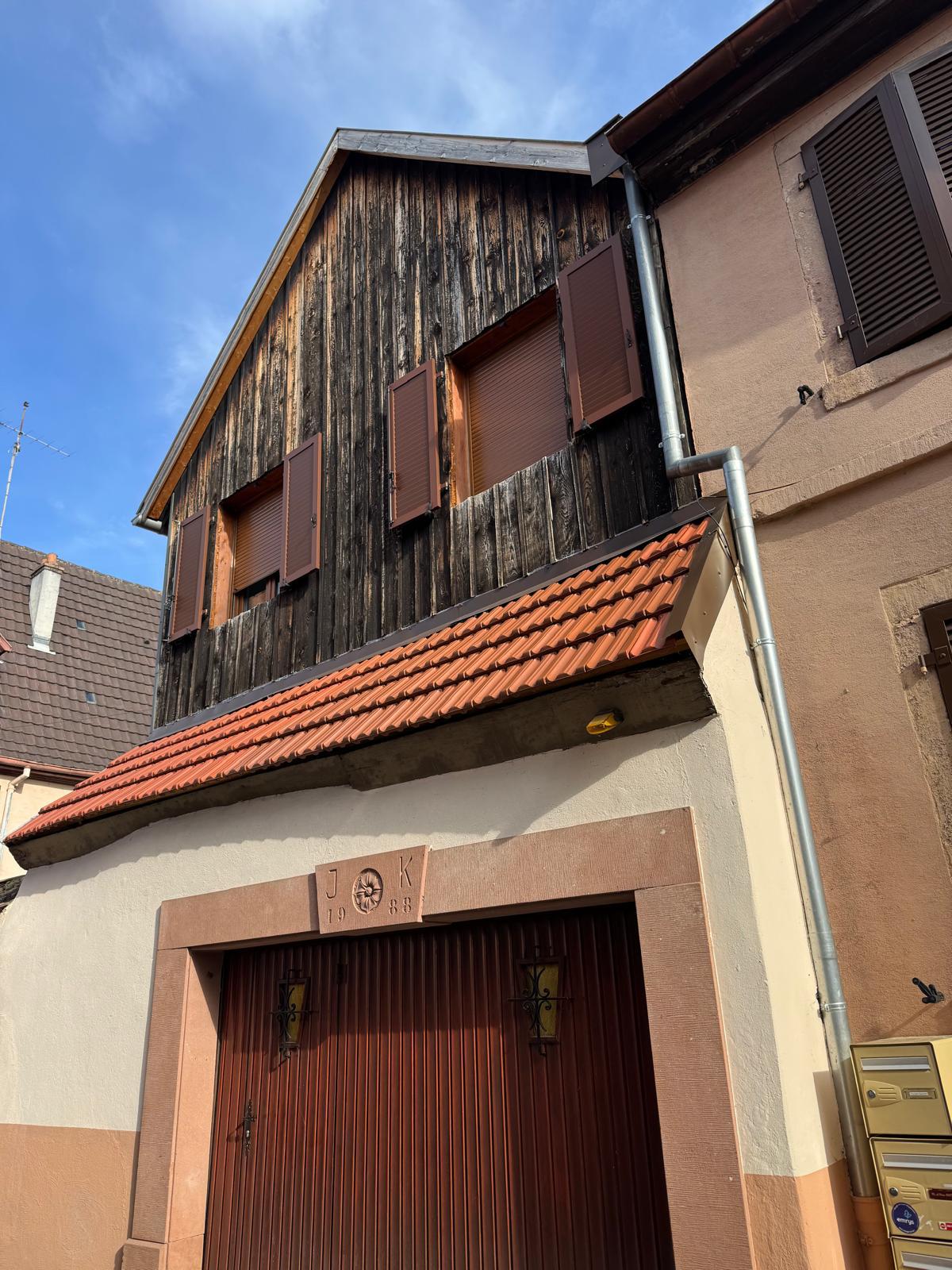 Rénovation thermique et esthétique des pignons de bardage de votre maison en bois Douglas à Guebwiller prés de Soultz avec finition alu et isolation mince
